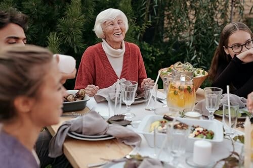 Family enjoying an outdoor dinner together.