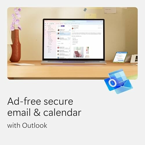 Outlook screen displaying email and calendar on a desk.
