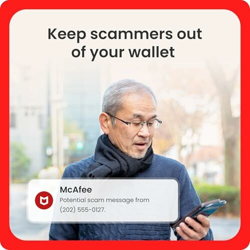 Elderly man receiving scam alert on phone.